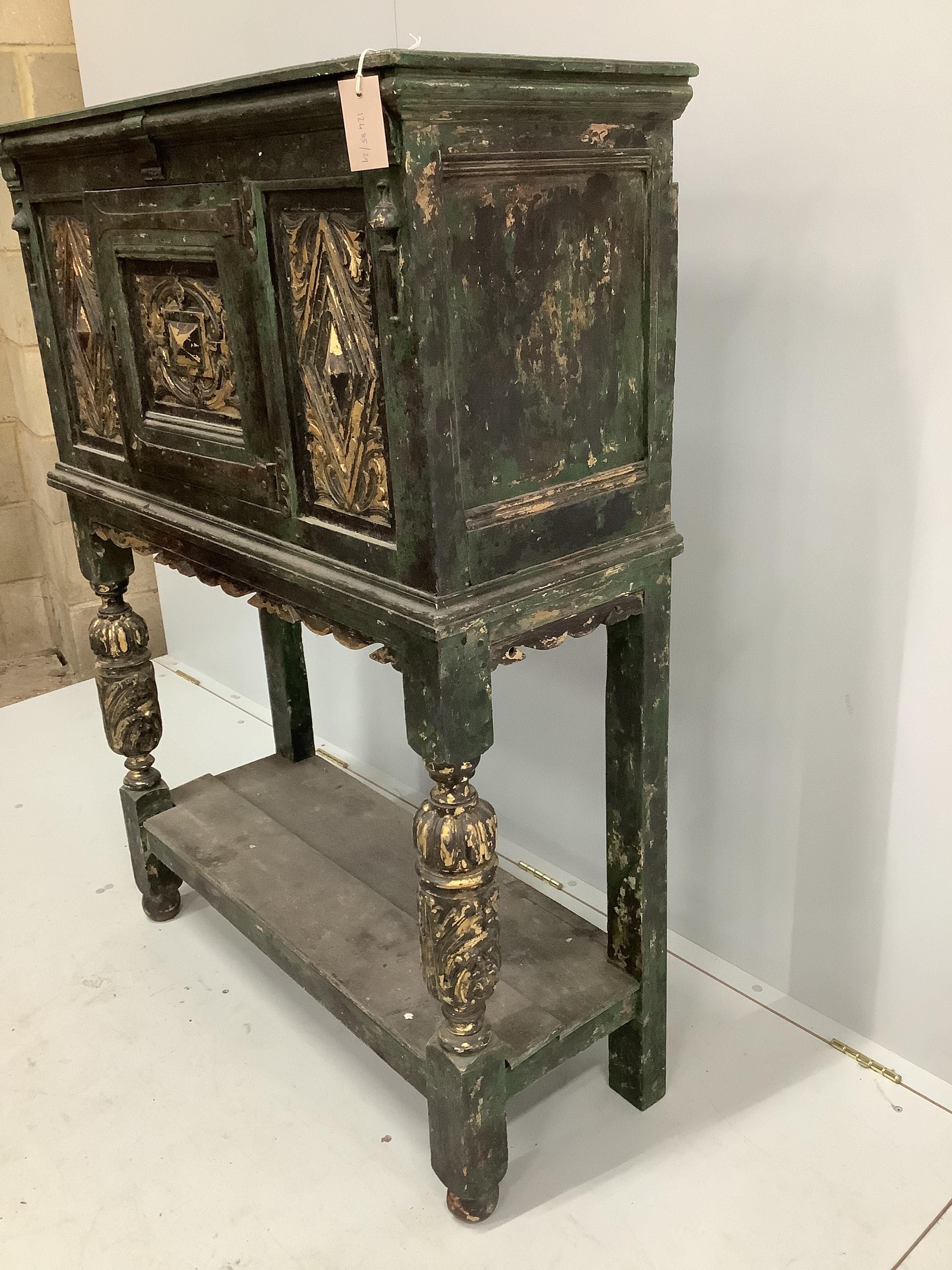 A Jacobean style painted oak cupboard on stand, width 98cm, depth 38cm, height 131cm